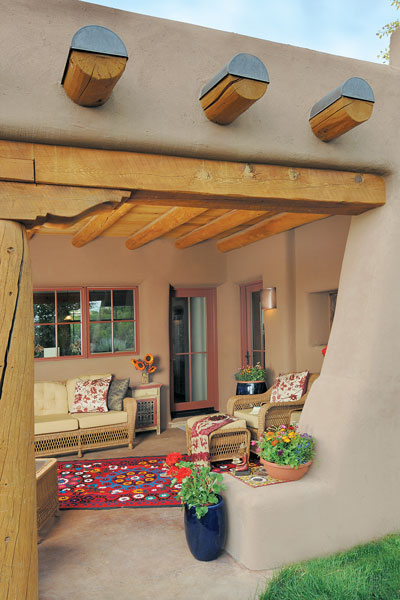 A portal on the back side of the house is a naturally cool place to relax during the warm months. As in the rest of the house, the wood is from sustainable sources.